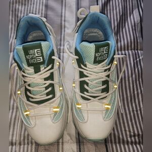 White and Teal Sneakers with Yellow Accents. Size Mens 10